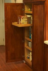 Each side of the custom pantry has five pull-out shelves mounted on full-extension drawer slides.