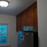 The clients also had cabinets installed in the adjacent laundry room that match the kitchen.