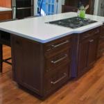 On both sides of the walnut island, we installed three sets of drawers mounted with full-extension, under-mount slides.