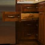 Angled drawers were built to maximize the space in the lower corner cabinet.