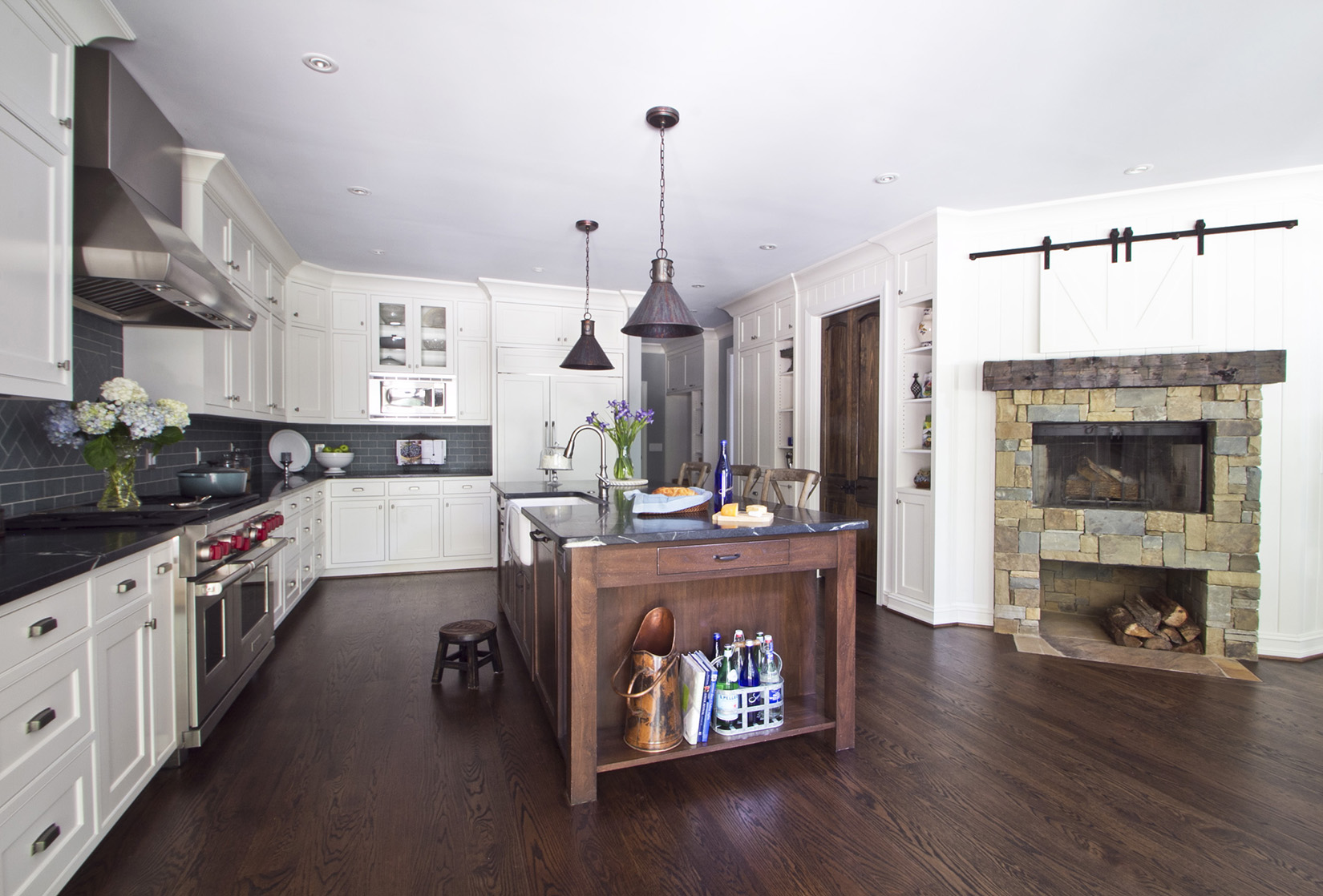 The island is made from walnut that was stained, distressed, glazed and then top-coated with clear lacquer.